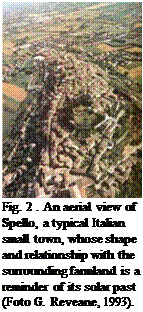 Подпись: Fig. 2 . An aerial view of Spello, a typical Italian small town, whose shape and relationship with the surrounding farmland is a reminder of its solar past (Foto G. Reveane, 1993). 